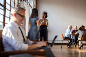 Casual office meeting and discussion.